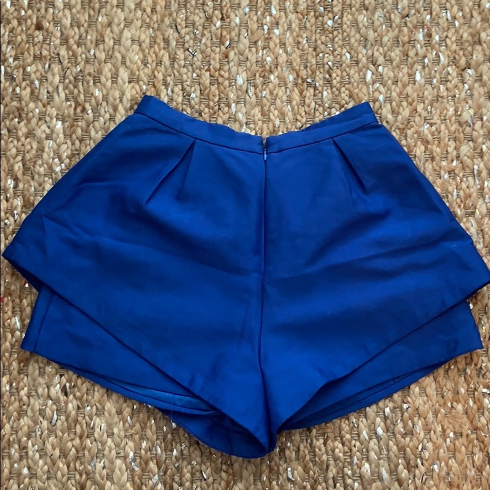 Blue high waist shorts with pockets.